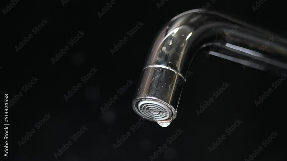 close up of faucet with flowing water close up of faucet with flowing water