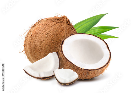 Coconut fruit with cut in half and leaves isolated on white background.