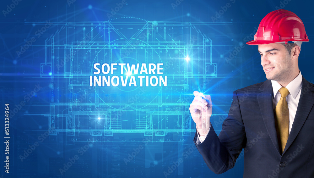 Handsome architect drawing with helmet