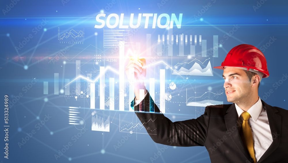 Young businessman with helmet drawing on virutal screen Young businessman with helmet drawing on virutal screen