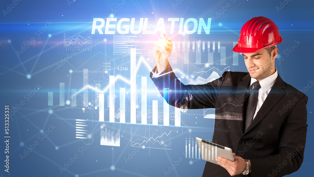 Young businessman with helmet drawing on virutal screen