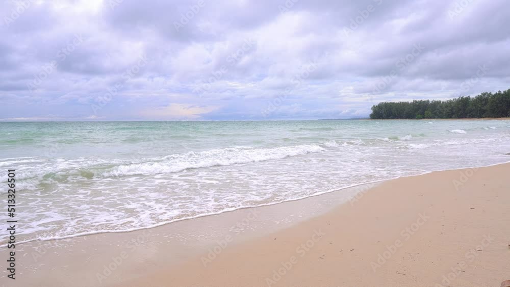 Beautiful beach with white sand, turquoise ocean water and blue sky with clouds in sunny day. Natural background for summer vacation. 4K Video. Thailand beach. Beautiful beach with white sand, turquoise ocean water and blue sky with clouds in sunny day. Natural background for summer vacation. 4K Video. Thailand beach.