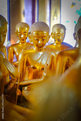 Viharn 52 Bhikkhuni, Wat Thepthidaram,temple in Bangkok.There are many golden statues of bhikkhuni. photo