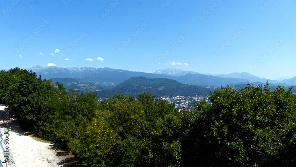 Grenoble, France - June 2022 : Visit the beautiful city of Grenoble in the middle of the Alps from the Bastille Grenoble, France - June 2022 : Visit the beautiful city of Grenoble in the middle of the Alps from the Bastille