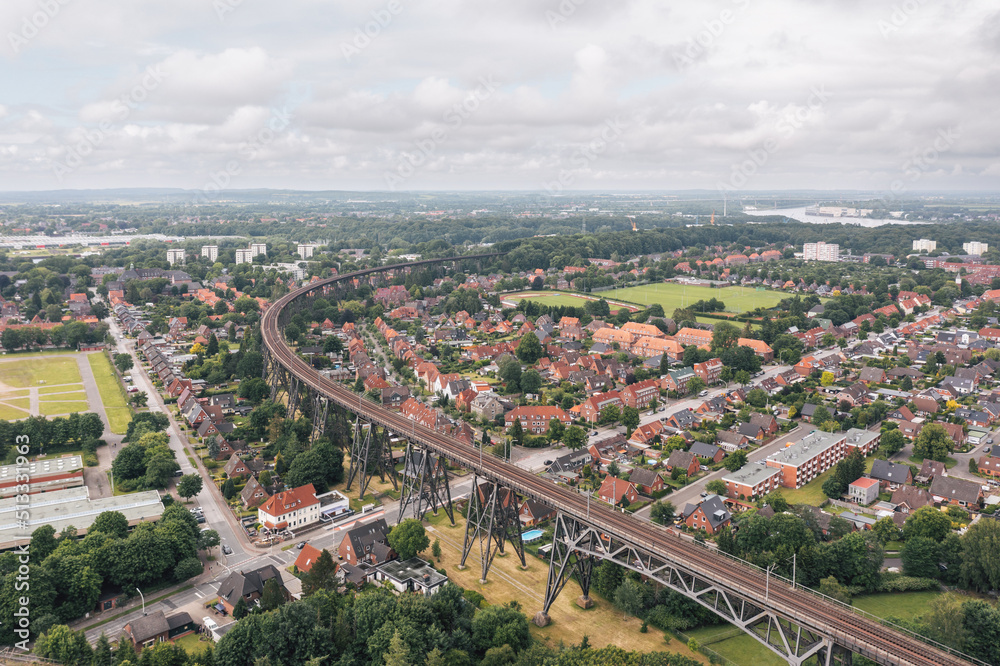 Aerial view on Rendsburg, Germany, with Rendsburger Hochbrücke railway viaduct inclination loop (Neumünster–Flensburg line) going through the city