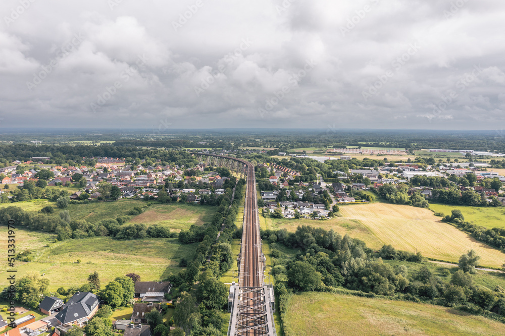 Scenic landscape near Rendsburg (Schleswig-Holstein, Germany) High Bridge (Rendsburger Hochbrücke) railway viaduct (Neumünster–Flensburg line) over Kiel Canal