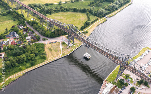 Rendsburg (Schleswig-Holstein, Germany) High Bridge (Rendsburger Hochbrücke) railway viaduct (Neumünster–Flensburg line) with Schwebefähre transporter bridge over Kiel Canal