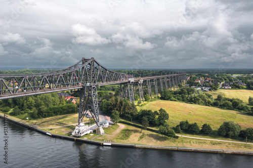 Obraz na płótnie Rendsburg (Schleswig-Holstein, Germany) High Bridge (Rendsburger Hochbrücke) railway viaduct (Neumünster–Flensburg line) with Schwebefähre transporter bridge over Kiel Canal w salonie