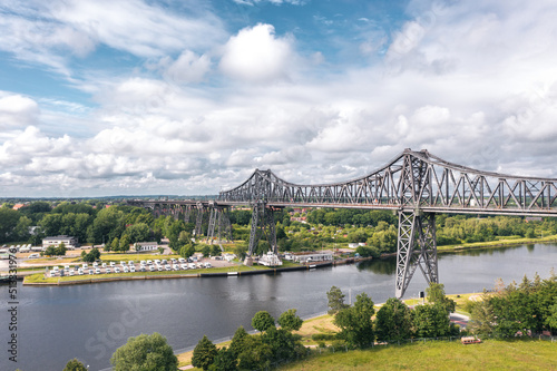Obraz na płótnie Rendsburg (Schleswig-Holstein, Germany) High Bridge (Rendsburger Hochbrücke) railway viaduct (Neumünster–Flensburg line) with Schwebefähre transporter bridge over Kiel Canal w salonie