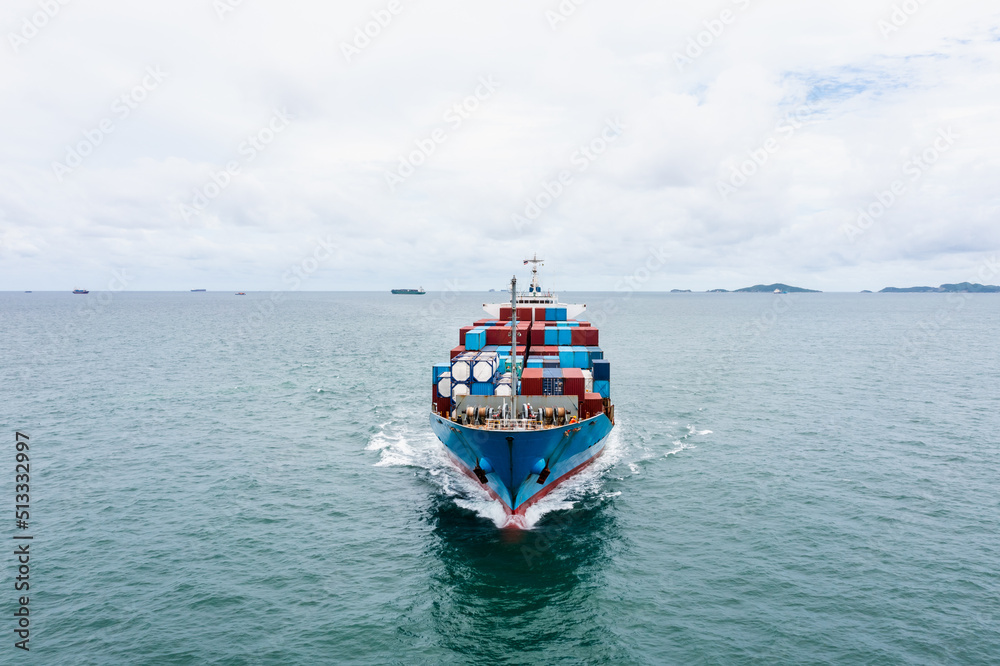 container cargo ship sailing full speed in green sea to transport of goods import export internationally or worldwide as business and industrial transport and marine services in open sea