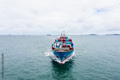container cargo ship sailing full speed in green sea to transport of goods import export internationally or worldwide as business and industrial transport and marine services in open sea