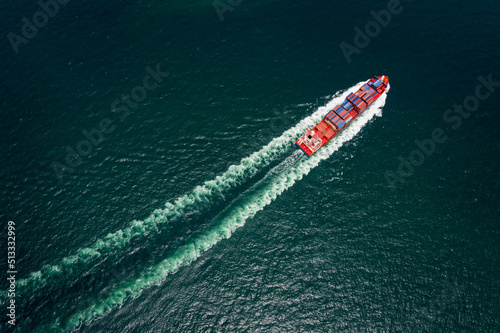 Wallpaper Mural container cargo ship sailing full speed in pacific ocean to transport goods import export internationally or worldwide as business and industrial transport and marine services open sea Torontodigital.ca