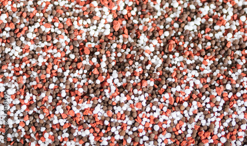 NPK letters made of mineral fertilizers background. N - nitrogen, P - phosphorus, K - potassium