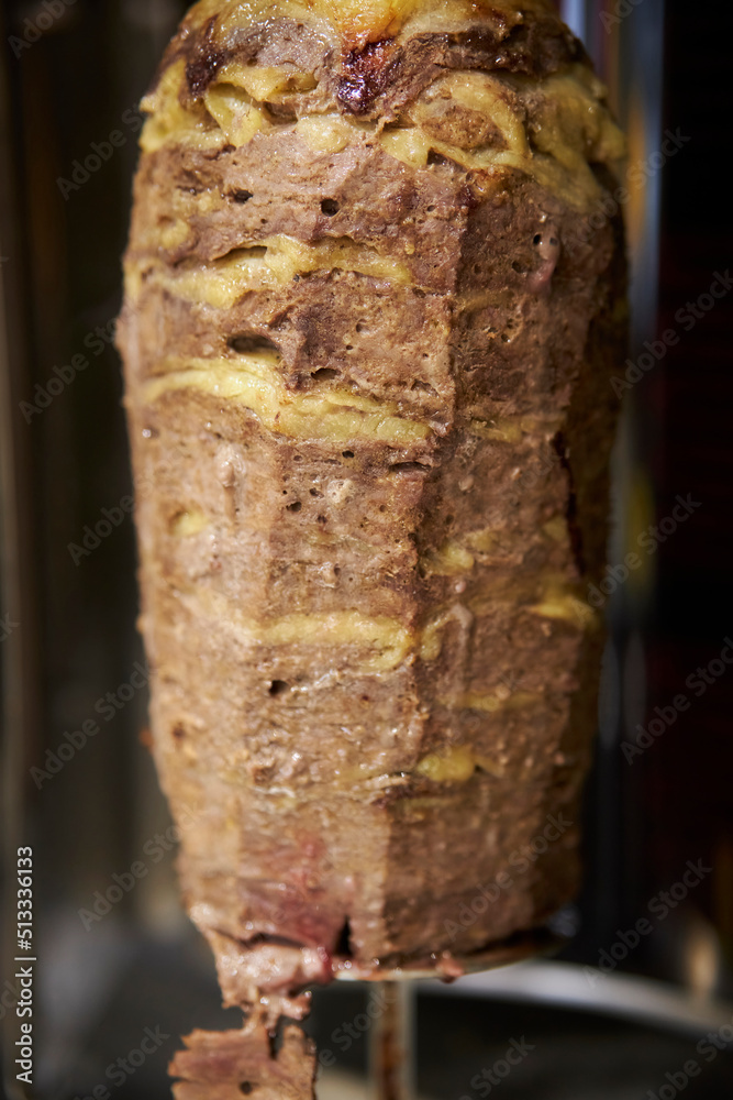 shawarma on a spit. Doner kebab on a rotating vertical spit. Traditional Turkish Meat Doner
