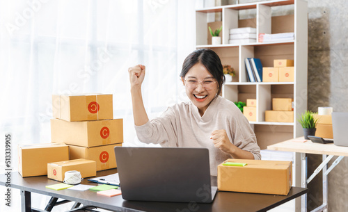 Young asian business woman startup sme small business entrepreneur SME distribution warehouse with parcel mail box. SME Online marketing and product packaging and delivery service. photo