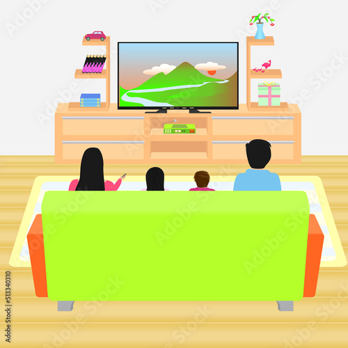 family of four sitting on sofa in living room watching tv together