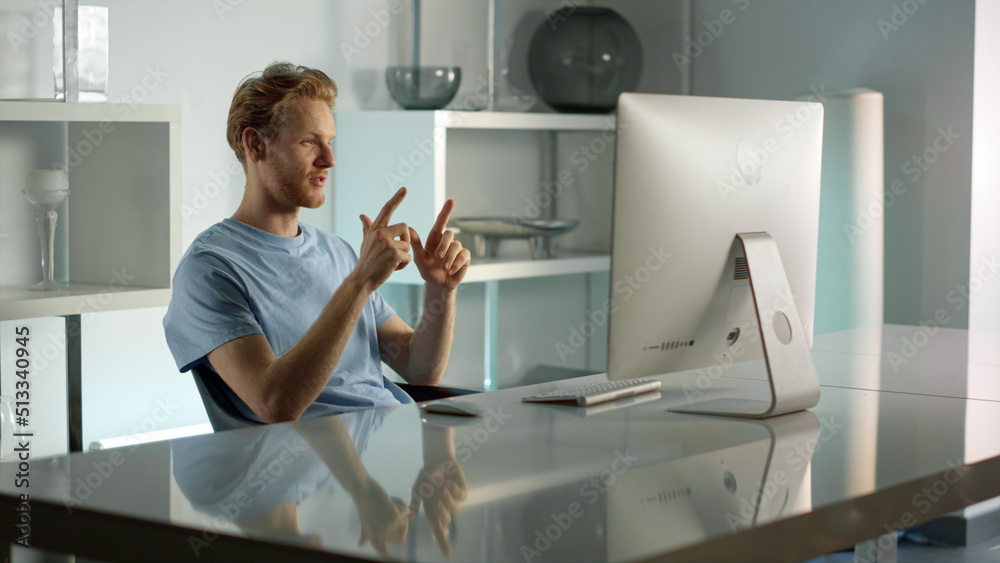 Smiling businessman having video conference with corporate team at home office. Smiling businessman having video conference with corporate team at home office.