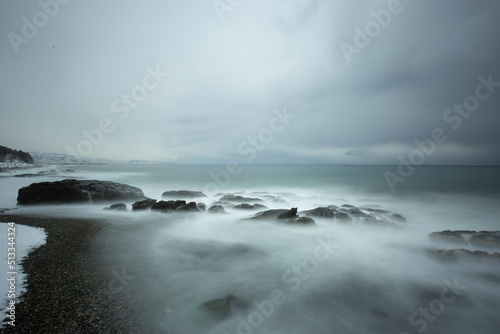 LONG EXPOSURE ON THE BEACH IN A BLACK SEA WAVY AND COLD WINTER DAY © hacimatrix