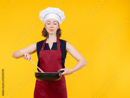 Cook is holding frying pan....