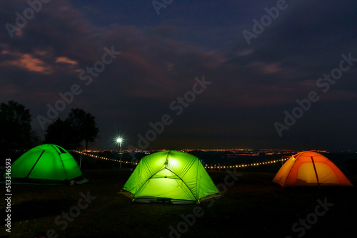 Comping tent at night in the forest.