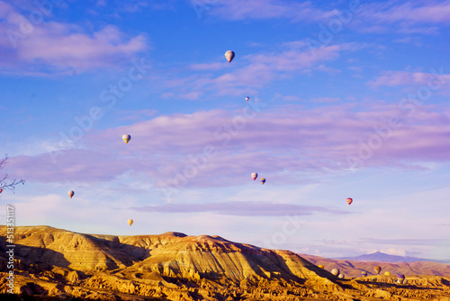 beautiful view of valley with ballons in cappadocia, turkey