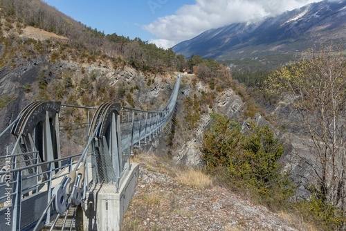 Aerial shot of the footbridge of L Ebron on the lake of Monteynard-Avignonet in Isere, France photo