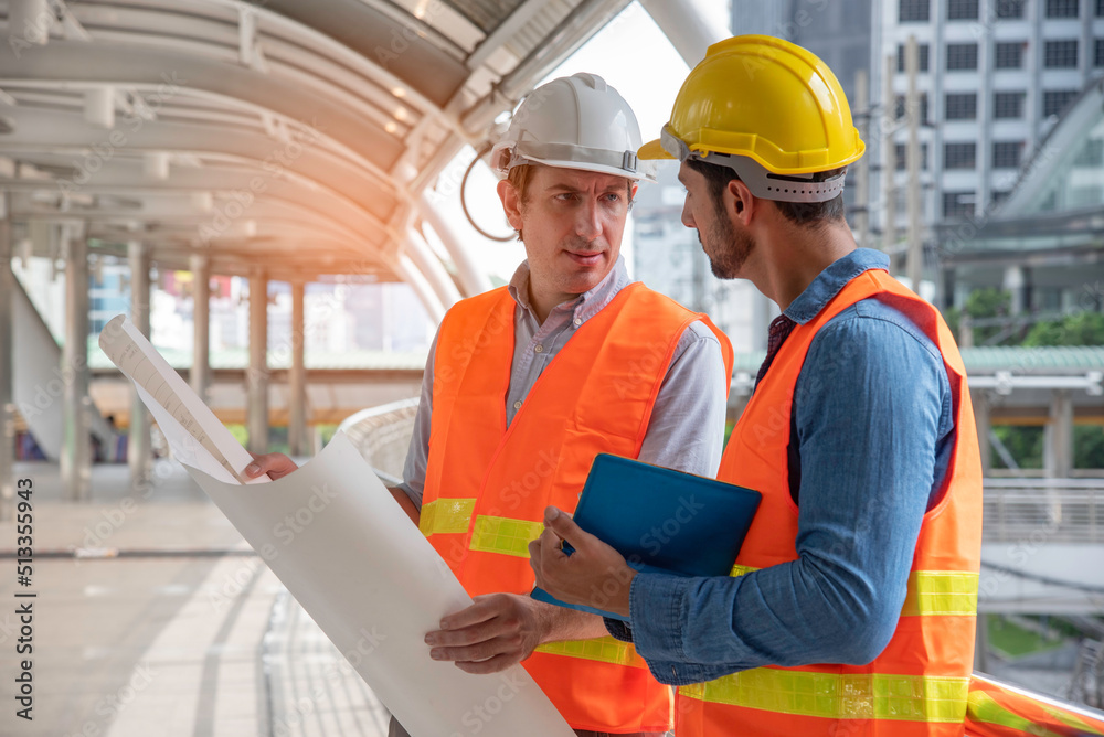 Professional engineer with safety vast and helmet explain project details to team for assigning work on construction site, business teamwork,
partnership,leadership and collaboration concept. Professional engineer with safety vast and helmet explain project details to team for assigning work on construction site, business teamwork,
partnership,leadership and collaboration concept.