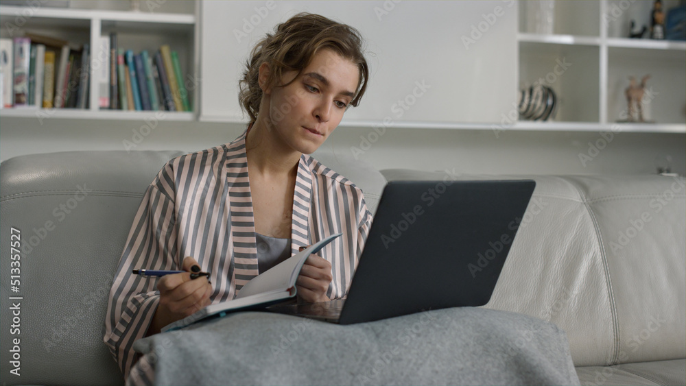 Focused student watching webinar at home office closeup. Thinking lady study Focused student watching webinar at home office closeup. Thinking lady study