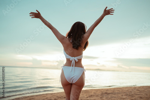 Smiling Young asian woman bikini sexy portrait at seaside beach tropical resting and relaxation travel lifestyle, Happy female freedom on summer vacation time on weekend.