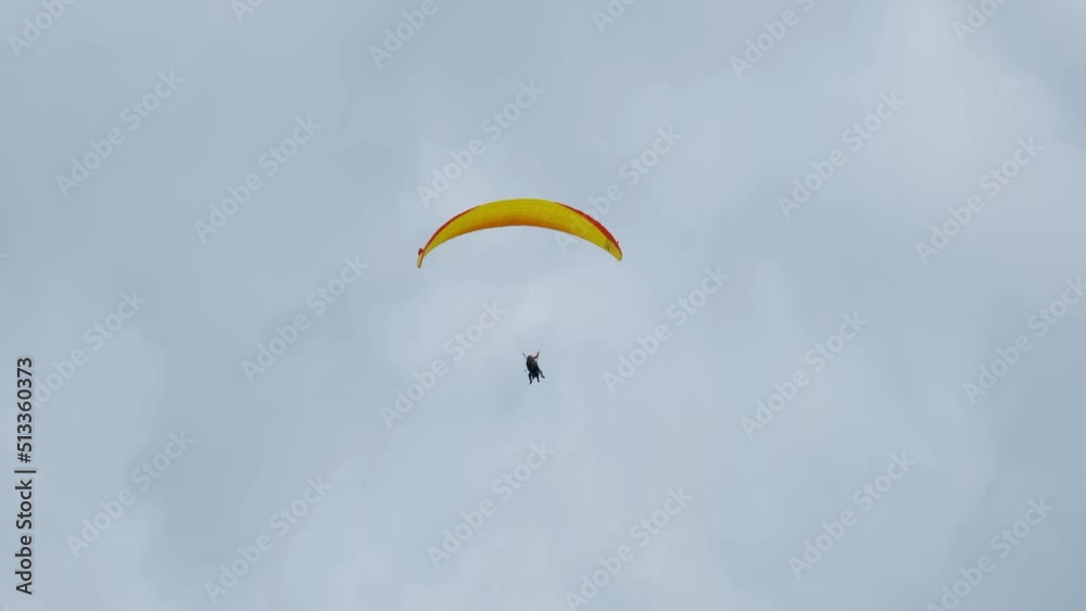 A handheld and follow focus with noise effect of flying paragliders in Interlaken before raining. A handheld and follow focus with noise effect of flying paragliders in Interlaken before raining.