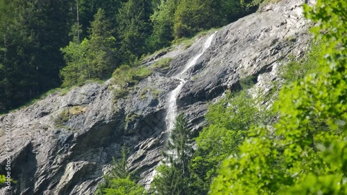 A handheld footage of small waterfall that going down to Kander River. photo