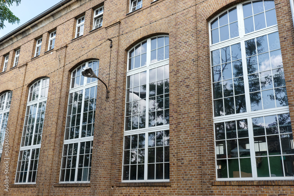 Large windows of the old factory building. Exterior view