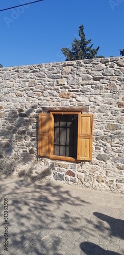 wooden window stone wall iron railing