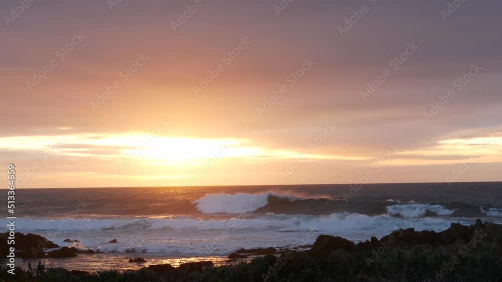 Rocky craggy pacific ocean coast, sea water waves crashing on rocks, 17-mile drive, Monterey California USA. Dramatic sunset sky nature near Point Lobos, Big Sur, Pebble beach. Flock of birds flying. Rocky craggy pacific ocean coast, sea water waves crashing on rocks, 17-mile drive, Monterey California USA. Dramatic sunset sky nature near Point Lobos, Big Sur, Pebble beach. Flock of birds flying.