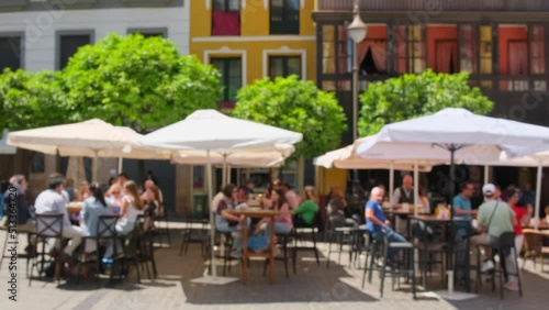 Defocused view of the traditional European outdoor cafe in summer photo