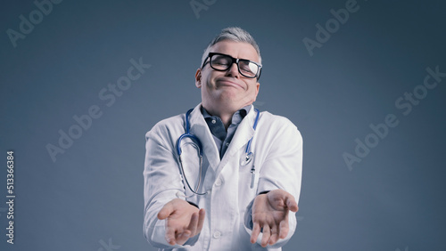 Funny clueless doctor shrugging and looking at camera