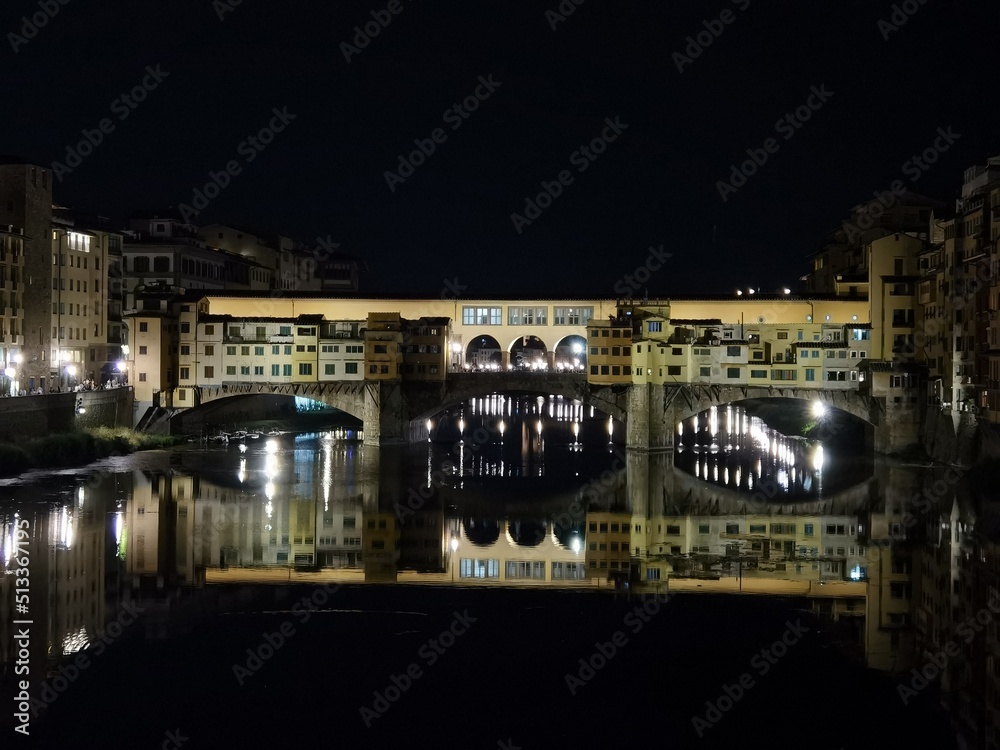 Night panorama of Ponte Vecchio, in Florence, on the Arno river.