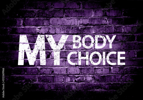 My body my choice grunge concept. Women's rights are human rights. Text on brick wall texture, mixed media.