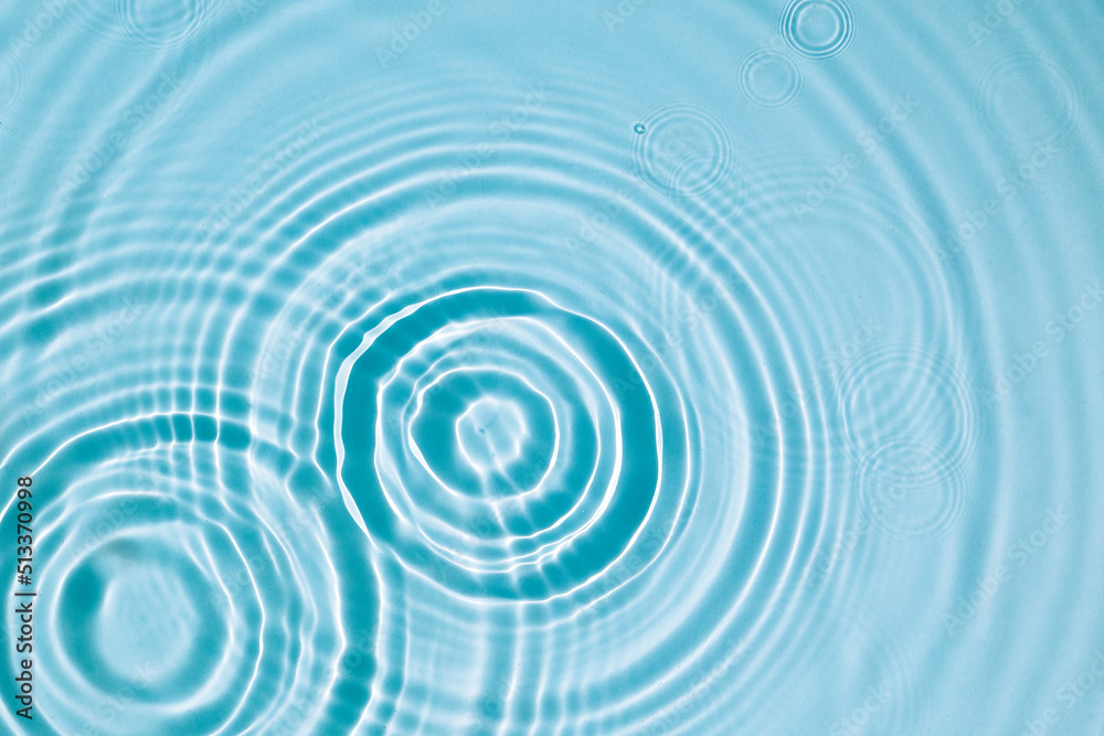 Blue water texture, surface with rings and ripples. Spa concept background. Flat lay, copy space. Blue water texture, surface with rings and ripples. Spa concept background. Flat lay, copy space.