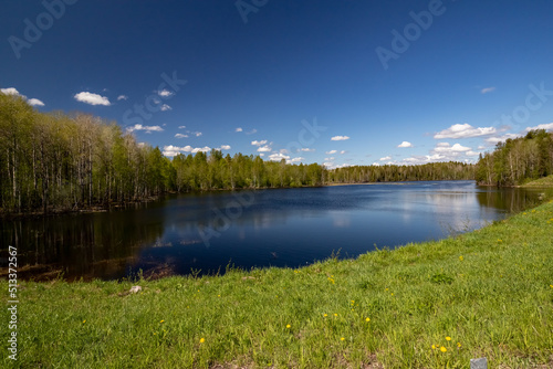 Fototapeta Naklejka Na Ścianę i Meble -  A lake in Karelia on a sunny day with a beautiful reflection. Nature of Karelia.
