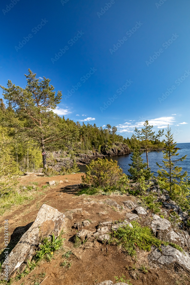 Rocky bay on the island of Valaam. The rocky shore of the island of Valaam. Nikonovsky Cape.