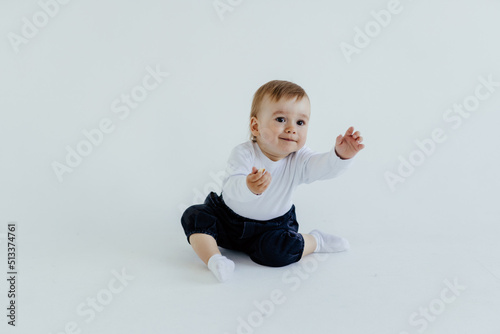 Portrait of happy joyful beautiful little boy on white background