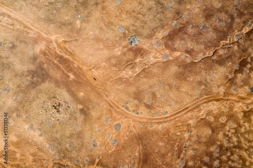 aerial view on man hiking on trail in desert