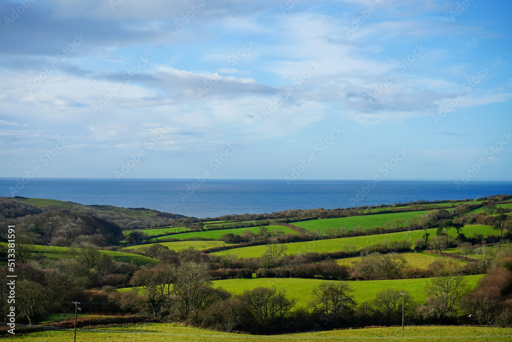 View over the countryside and ocean with blue skies View over the countryside and ocean with blue skies