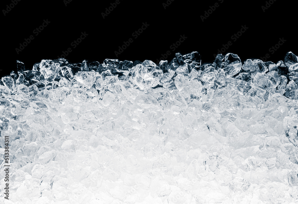 Ice cubes heap on black background. Pieces of crushed ice cubes on black background.