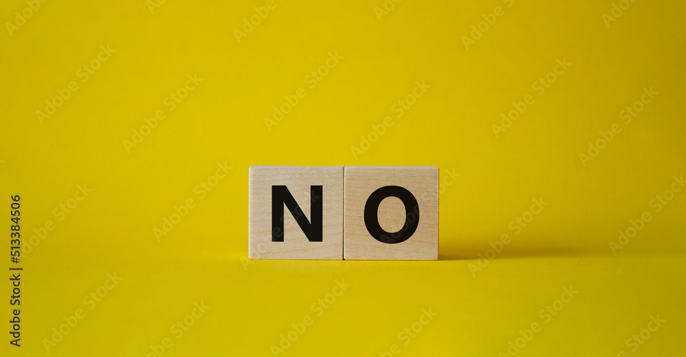 No symbol. Concept words No on wooden blocks. Beautiful yellow background. Business and No concept. Copy space.