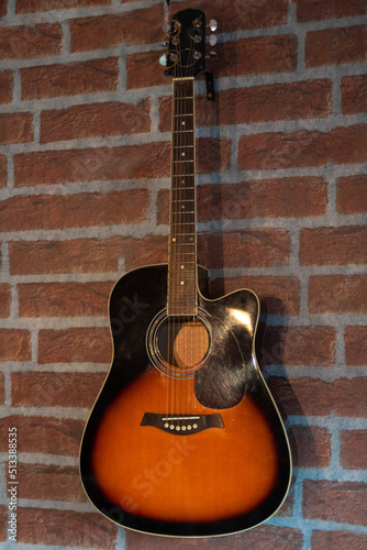Acoustic guitar, beautiful guitar used decorating a barber shop, selective focus. © Milton Buzon
