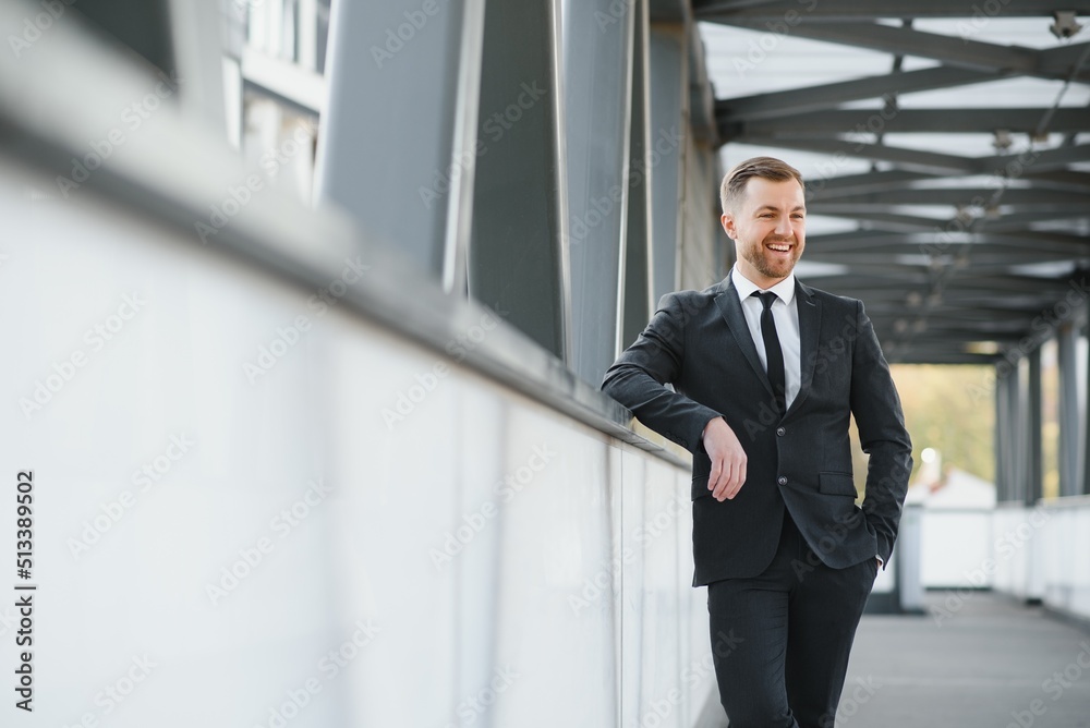 Portrait of an handsome businessman in an urban setting Portrait of an handsome businessman in an urban setting