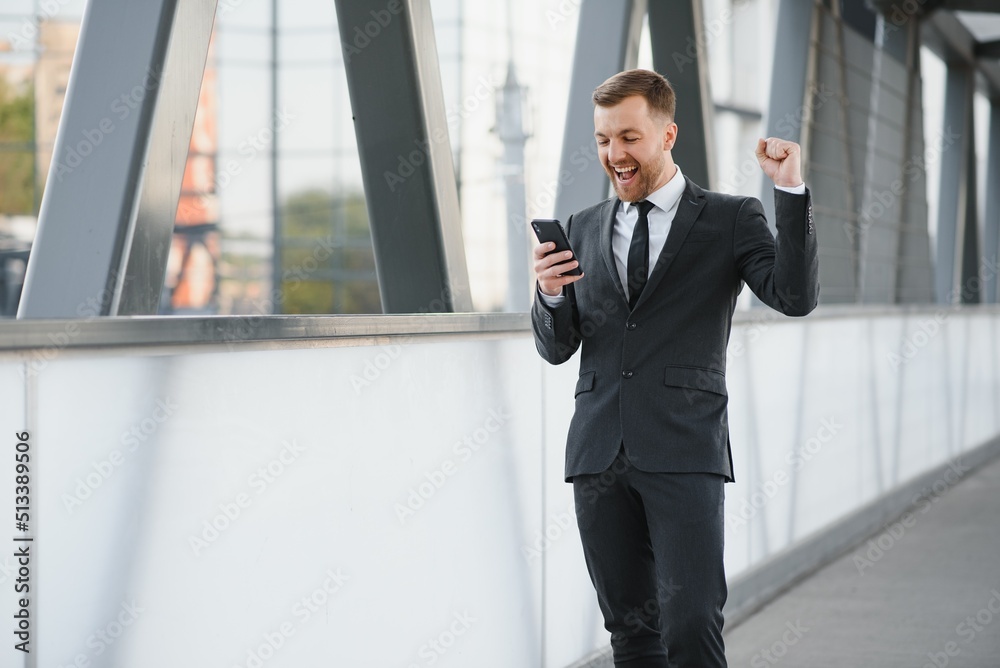 Portrait of a smiling businessman in a modern business environment Portrait of a smiling businessman in a modern business environment