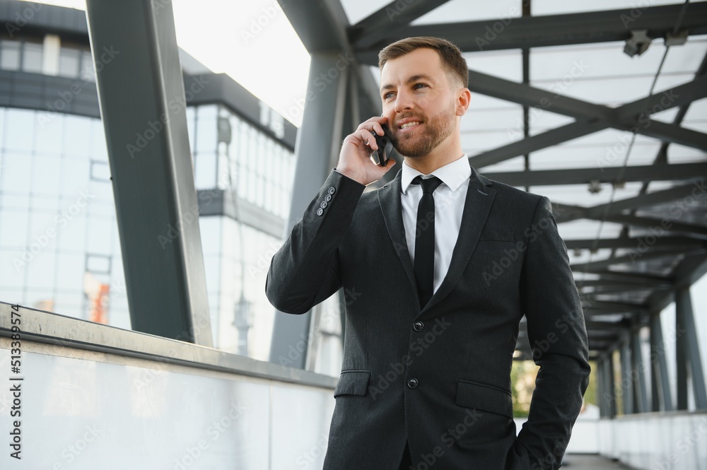 Portrait of a smiling businessman in a modern business environment Portrait of a smiling businessman in a modern business environment